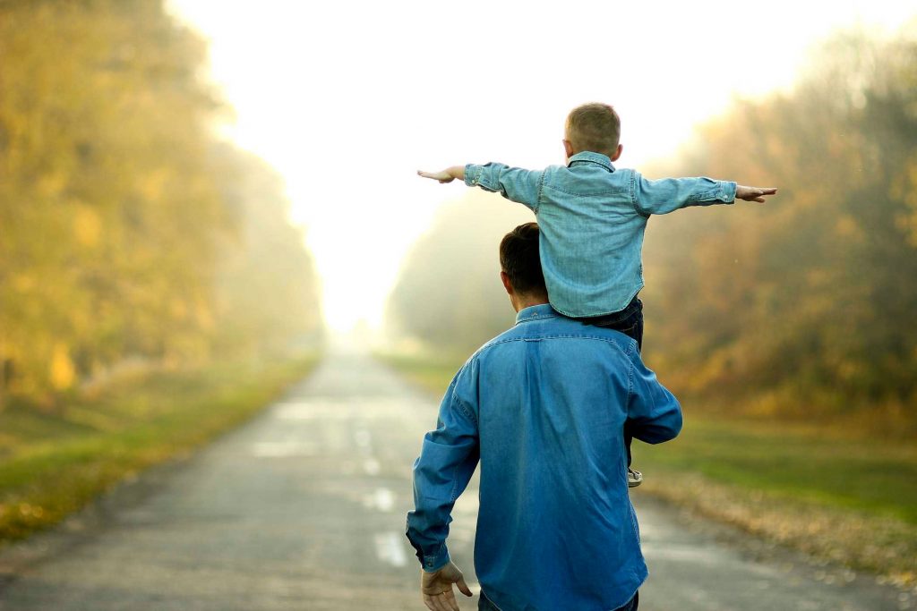 Photo and father and son in aspiring pose.